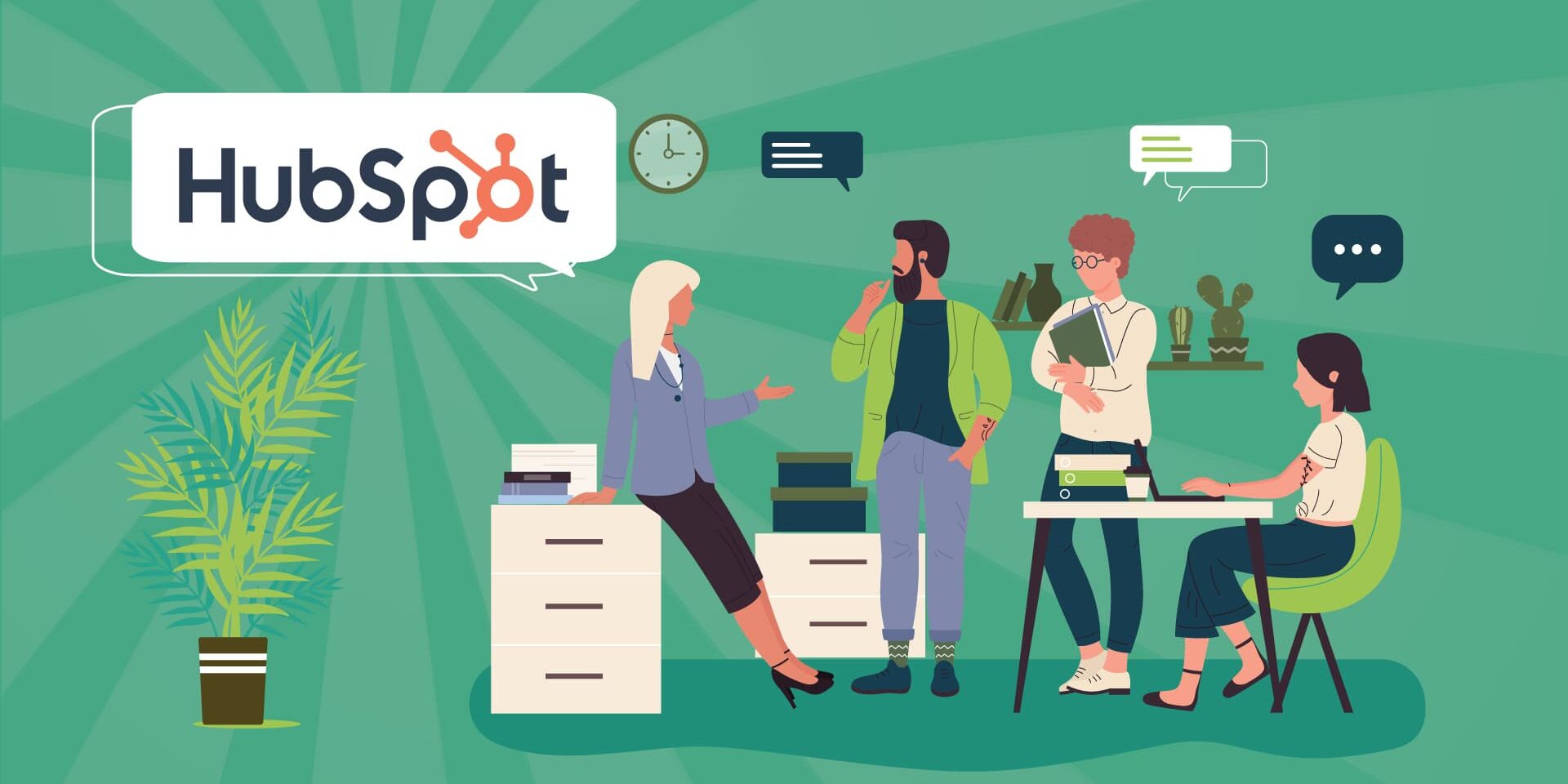Four people in an office talking about HubSpot