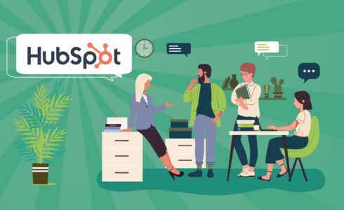 Four people in an office talking about HubSpot