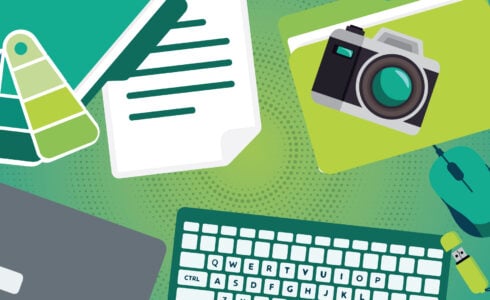 Marketing team desk with design and content tools, representing how long marketing takes to work.